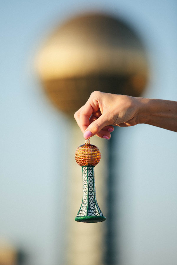 Guinn and Derek's Sunsphere Ornament in front of the Sunsphere