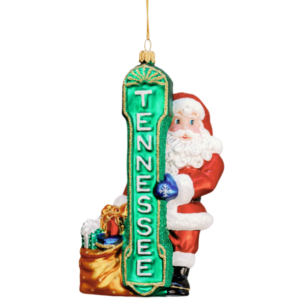 Christmas ornament with Santa hiding behind the Tennessee theater